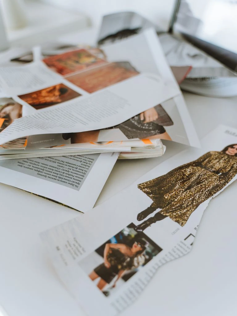 An overhead photograph of a printed issue of the Brand Moat newsletter resting on a desk.